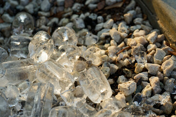 Pile of Ice Cubes on White Gravel in Summer Sunlight in Copenhagen CPH