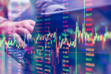 Businessman using a laptop with stock market data, trading graphs, and analytics overlay. Concept of finance and investment with cryptocurrency, online trading and market research.