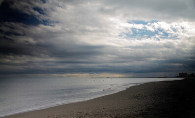 The beach between lights and shadows