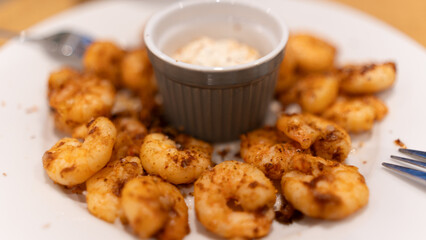 Golden fried garlic shrimp with aromatic herbs and creamy center sauce. Gourmet seafood dish perfect for restaurant menus, food blogs, and culinary photography