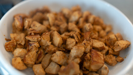 Juicy cubed chicken sautéed with garlic and minimal oil, steaming fresh. Healthy protein dish perfect for meal prep, fitness recipes, and food photography