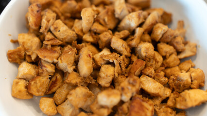 Juicy cubed chicken sautéed with garlic and minimal oil, steaming fresh. Healthy protein dish perfect for meal prep, fitness recipes, and food photography