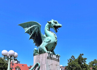 Dragon - symbol of the Slovenian capital on the Dragon Bridge in Ljubljana, Slovenia
