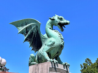 Dragon - symbol of the Slovenian capital on the Dragon Bridge in Ljubljana, Slovenia