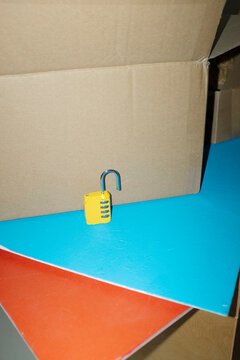 Yellow lock / padlock with code in colourful background with flashligh