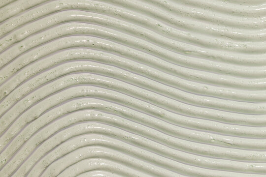 Textured green face care clay mask With Smooth, Wavy Pattern