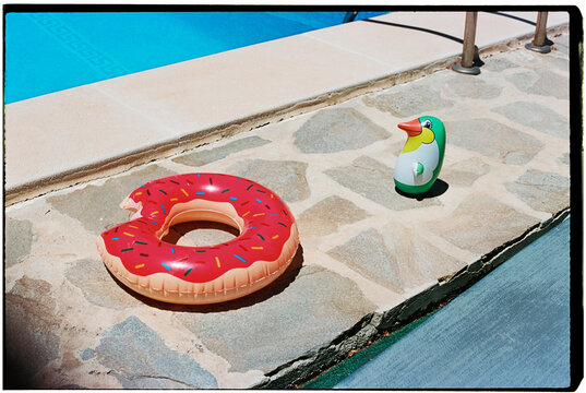 floaties on the poolside, shot on 35mm film