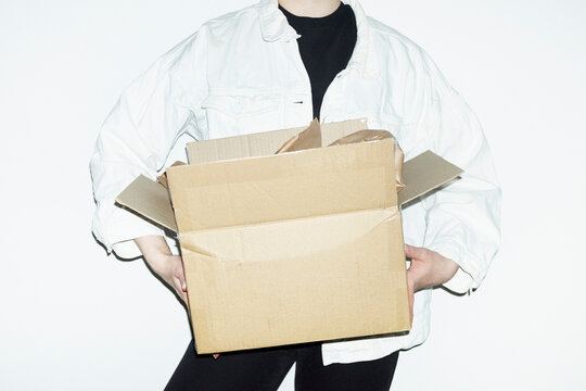 Person opening brown cardboard mail parcel package delivery boxes