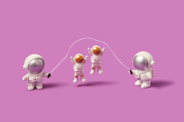 Astronauts jump rope on pink background