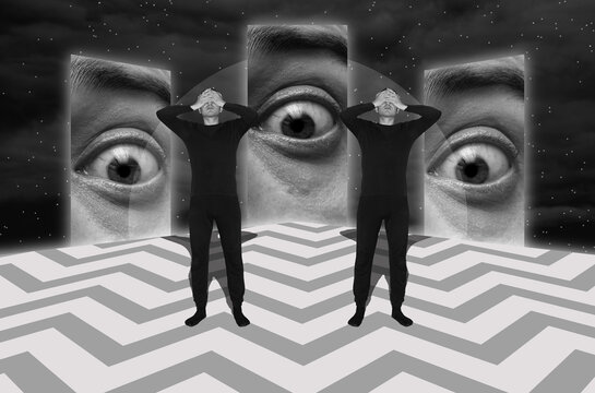Two men standing with their faces covered in hands against giant eyes