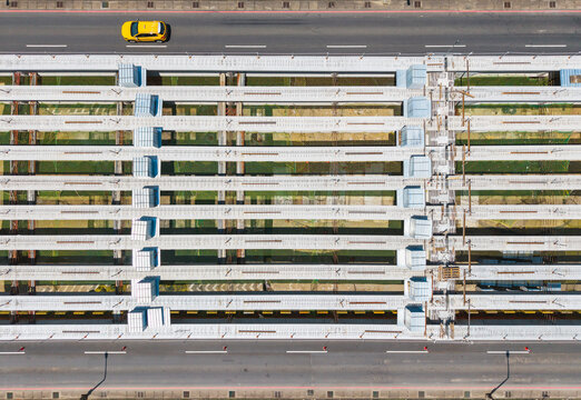 Aerial View of Elevated Road Construction With Yellow Car