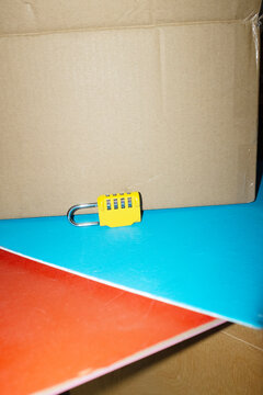 Yellow lock / padlock with code in colourful background with flashligh