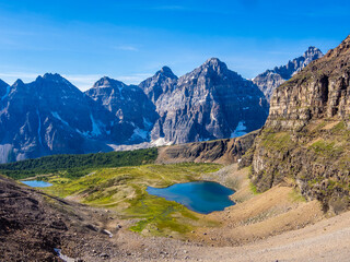 Rugged peaks and alpine valley from Mount Temple slopes in Banff