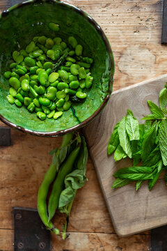 Blanched broad beans and herbs.