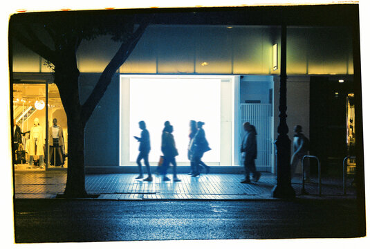People silhouettes in the night city