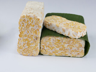 Sliced of Tempeh or tempe isolated on white background . Tempeh is a traditional Indonesian food made from fermented soy beans. 