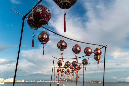 Chinese lantern garland under blue sky