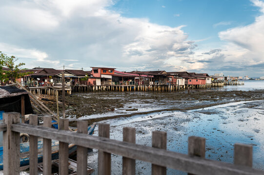 Colorful stilt houses at low tide