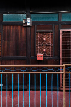 Fototapeta Wrought iron and red mailbox