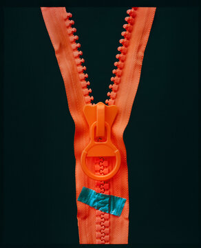 Orange zipper on  black 