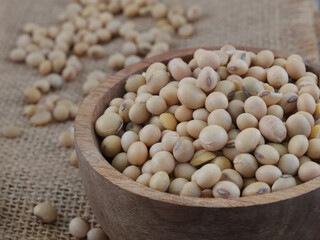 Soy Beans seeds in wooden bowl on sackcloth or burlap, super food, vegetarian.