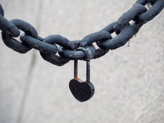 Heart-shaped Padlock Secured on Heavy Metal Chain