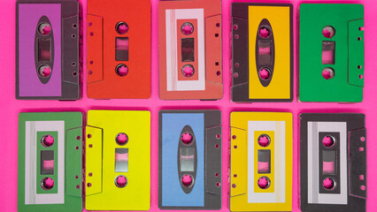 Colorful Audio Cassettes Retro Music Tapes on Pink Background