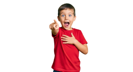 A young boy in a red shirt points with excitement and surprise against a black background looking forward