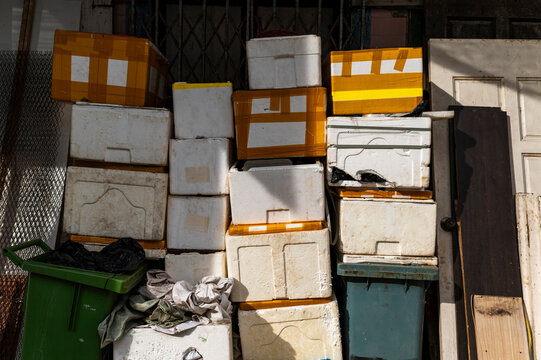 Stacked boxes and plastic bins