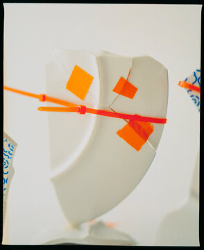 Broken Porcelain Plate With Bonds