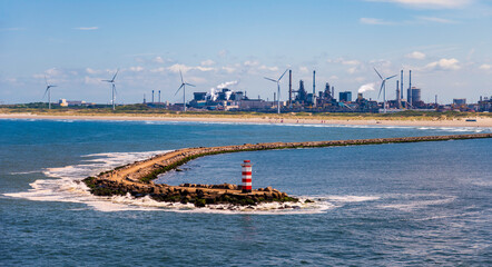 Dutch beaches with leisure craft and wind turbines on the shoreline
