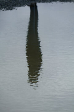 Man shadow reflection in the water.
