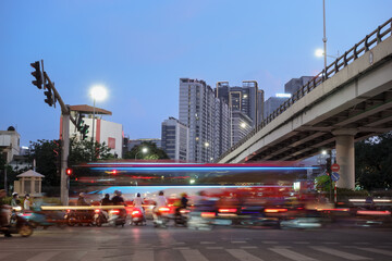 Busy street life in Lang street in Hanoi city during twilight wi