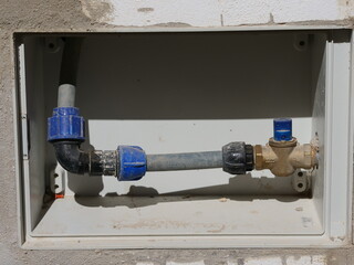 Water meter box containing the water installation; the box houses the main water pipe, shut-off...