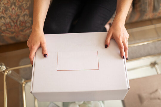 fashion designer packing a finished garment