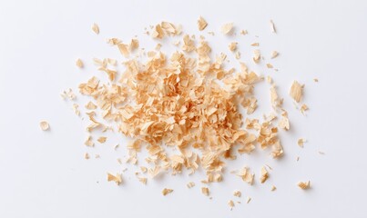 Light tan wood shavings scattered on white background