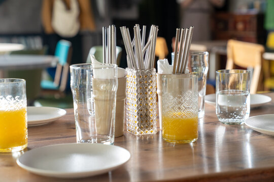 Table setting with juice and glasses in cafe