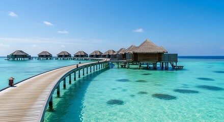 Overwater bungalows with thatched roofs connected by a wooden walkway in a clear turquoise sea