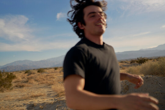 Man running in Desert Landscape During Golden Hour