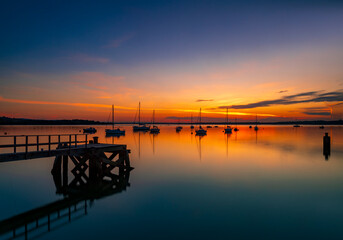 Fototapeta premium Sunset over Poole Harbour at Hamworthy pier