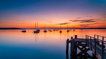 Obraz premium Sunset over Poole Harbour at Hamworthy pier