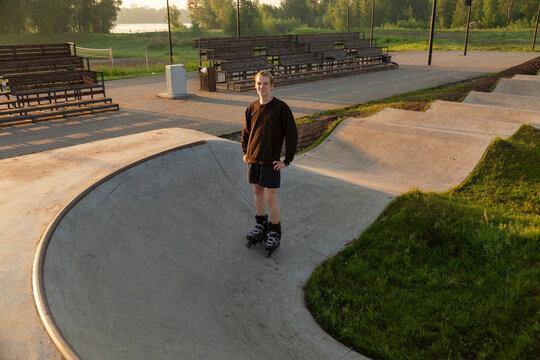 Young athlete wearing inline skates standing 