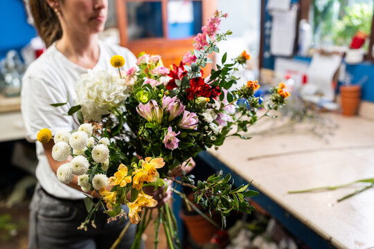 Florist Arranging Colorful Bouquet in Flower Shop