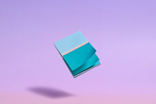A minimalist floating notepad in shades of blue and green