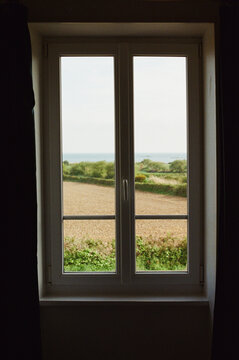 Fototapeta Sea and measodws outside of bedroom's window