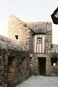 Ancient stone walls and buildings inside Mont Saint Michel village