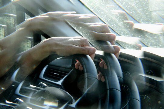 detail of a man driving a car, in a kaleidoscopic image