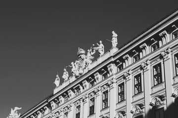 Black and White Architectural Photography of Ornate Building Facade and Statues