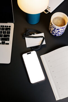 Smartphone on Desk with Office Essentials
