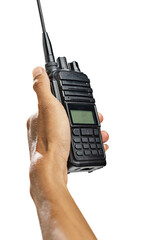 Closeup view of a human hand holding a black walkie talkie radio communication device isolated over a white background